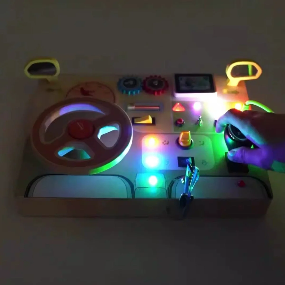 Toddler exploring the Montessori wooden car dashboard