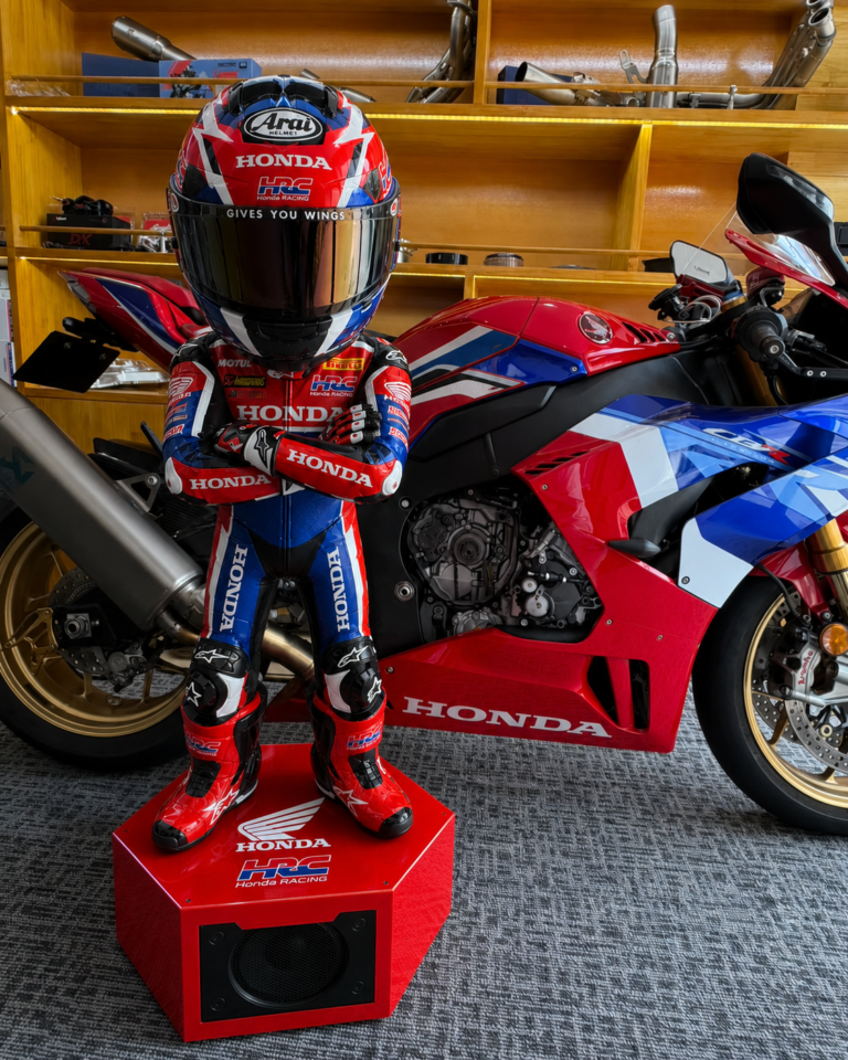 Honda Racing Smart Edition beside a Honda sport motorcycle