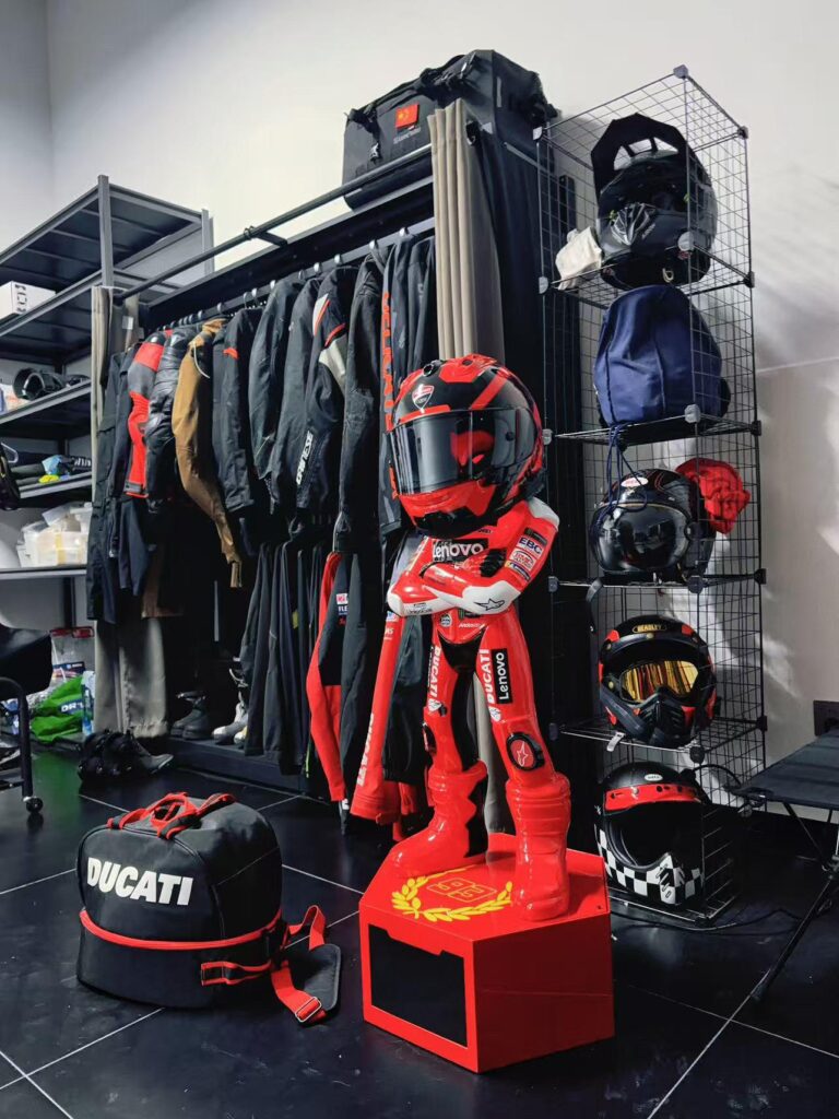 Customer helmet station setup surrounded by riding gear